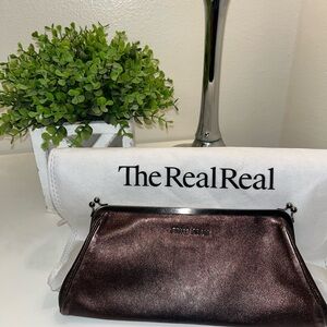 Metallic leather clutch purse with kiss-lock frame by Miu Miu Made in Italy
